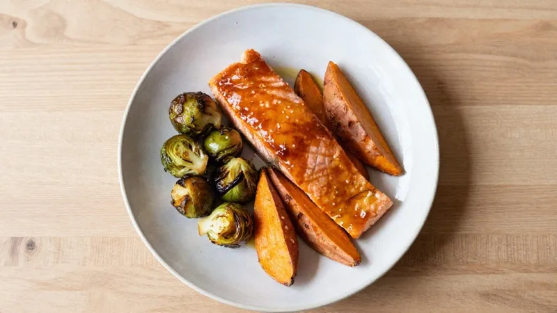 Maple-Glazed Salmon with Roasted Brussels Sprouts and Sweet Potato Wedges