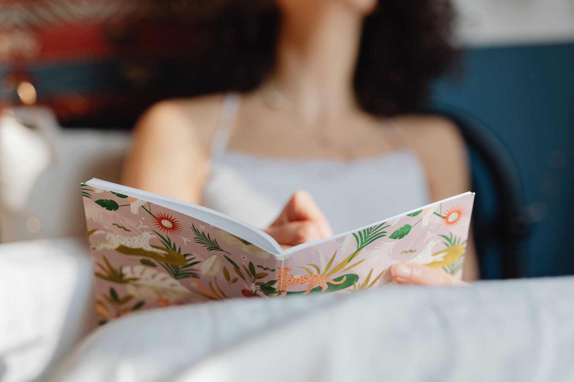 A woman reading in warm, cosy light